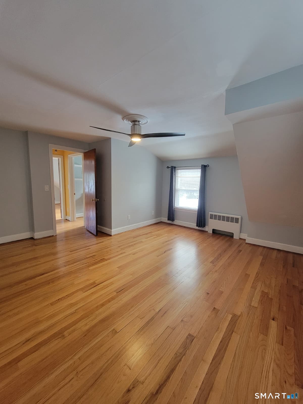 895 Pleasant Valley Road South Windsor, CT 06074 - Photo 15 of 15 a view of empty room with wooden floor and fan