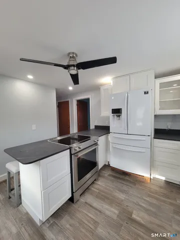 a kitchen with a stove and a microwave