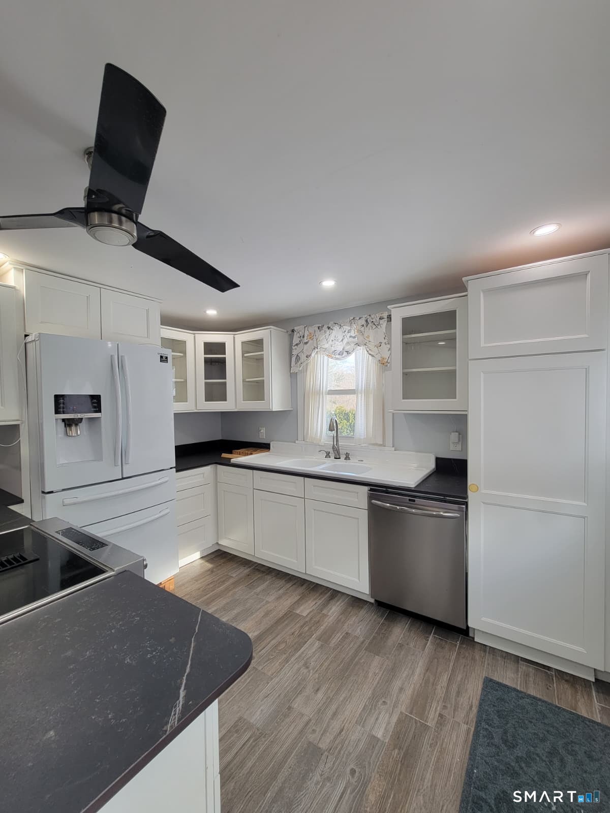 895 Pleasant Valley Road South Windsor, CT 06074 - Photo 4 of 15 a large kitchen with a stove a sink and a refrigerator