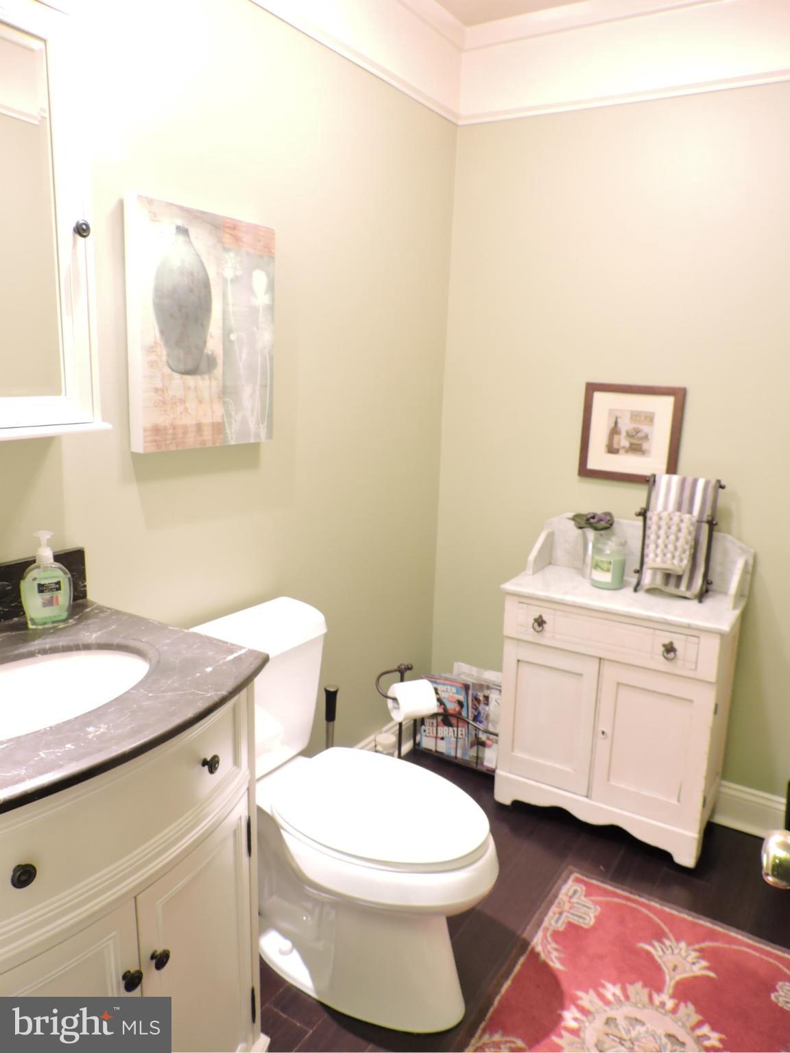 2448 Rippling Brook Road Frederick, MD 21701 - Photo 17 of 30 a bathroom with a granite countertop toilet sink and mirror