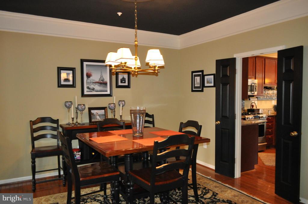 2448 Rippling Brook Road Frederick, MD 21701 - Photo 5 of 30 a view of a dining room with furniture and chandelier