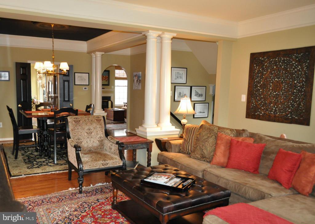 2448 Rippling Brook Road Frederick, MD 21701 - Photo 7 of 30 a living room with furniture and a chandelier