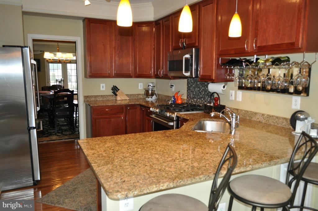 2448 Rippling Brook Road Frederick, MD 21701 - Photo 9 of 30 a kitchen with a sink a stove and cabinets
