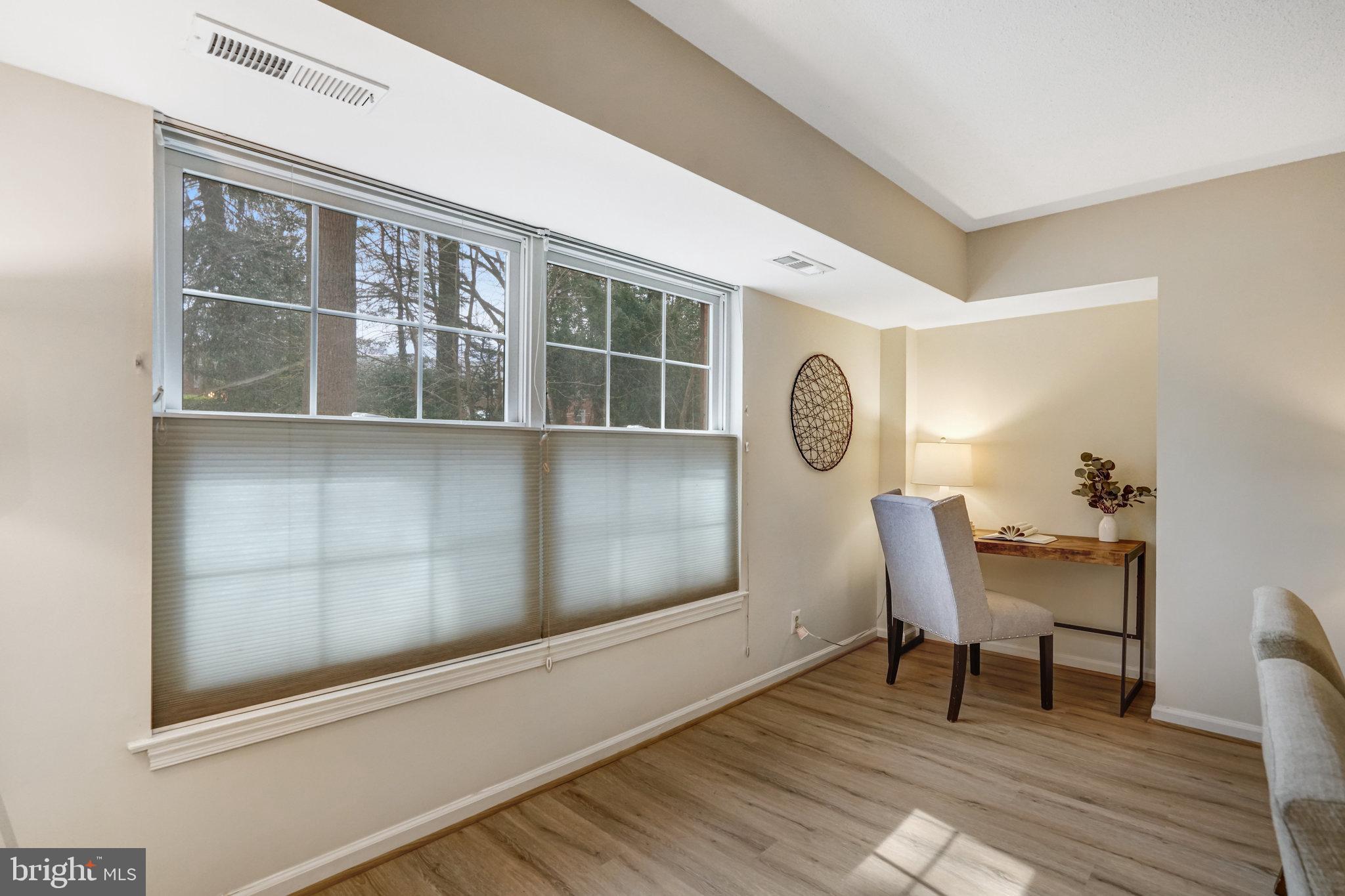 7640 Provincial Drive, Unit 109 McLean, VA 22102 - Photo 11 of 47 a workspace with wooden floor and windows