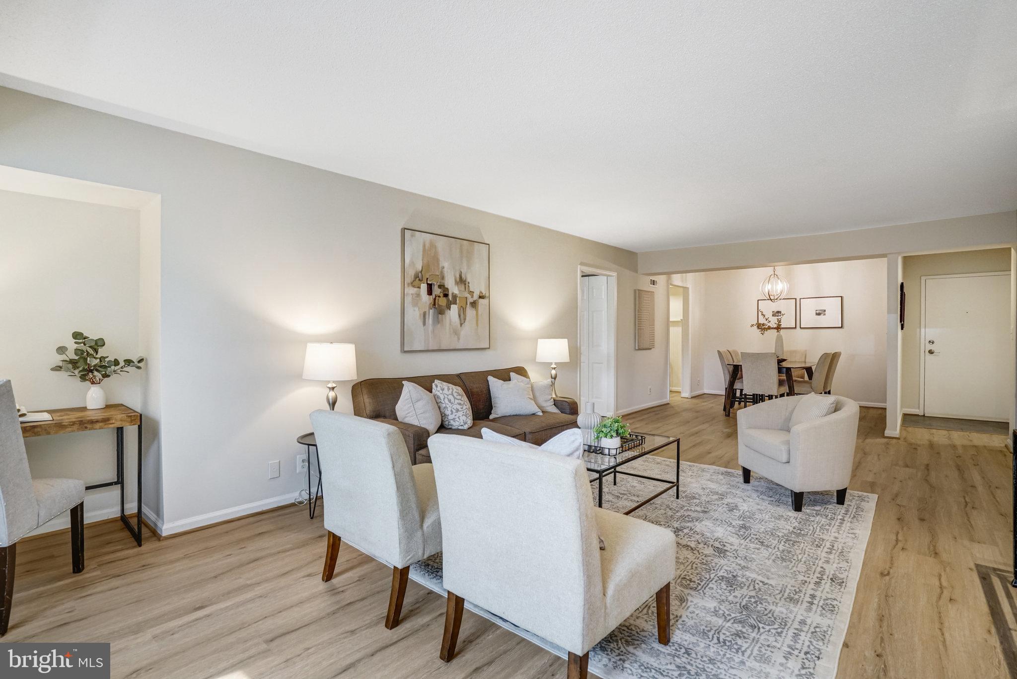 7640 Provincial Drive, Unit 109 McLean, VA 22102 - Photo 12 of 47 a living room with furniture and wooden floor