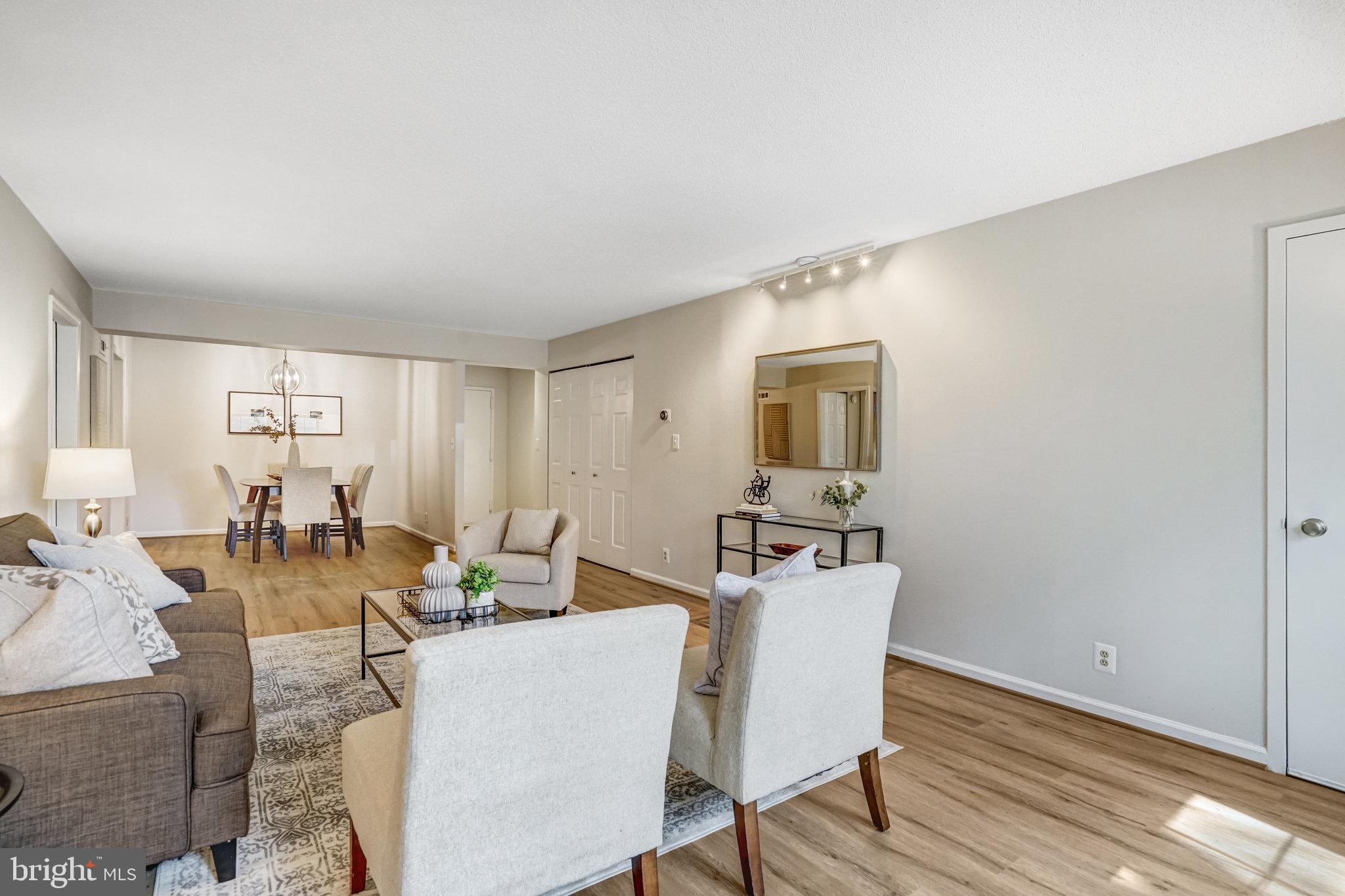 7640 Provincial Drive, Unit 109 McLean, VA 22102 - Photo 13 of 47 a view of a dining room with furniture and wooden floor