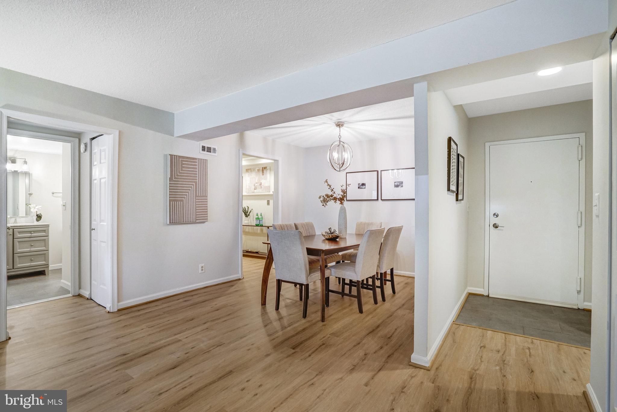 7640 Provincial Drive, Unit 109 McLean, VA 22102 - Photo 14 of 47 a view of a dining room with furniture and wooden floor