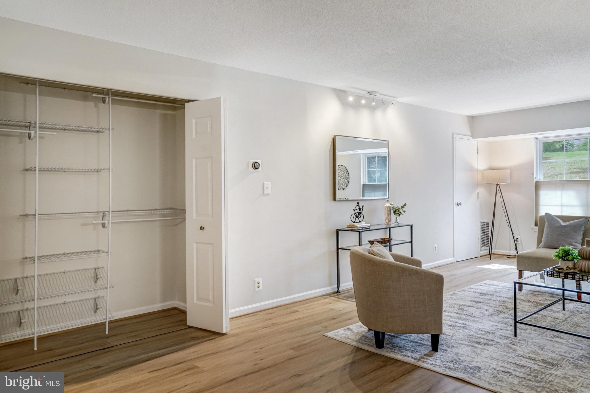 7640 Provincial Drive, Unit 109 McLean, VA 22102 - Photo 17 of 47 a living room with furniture and a wooden floor