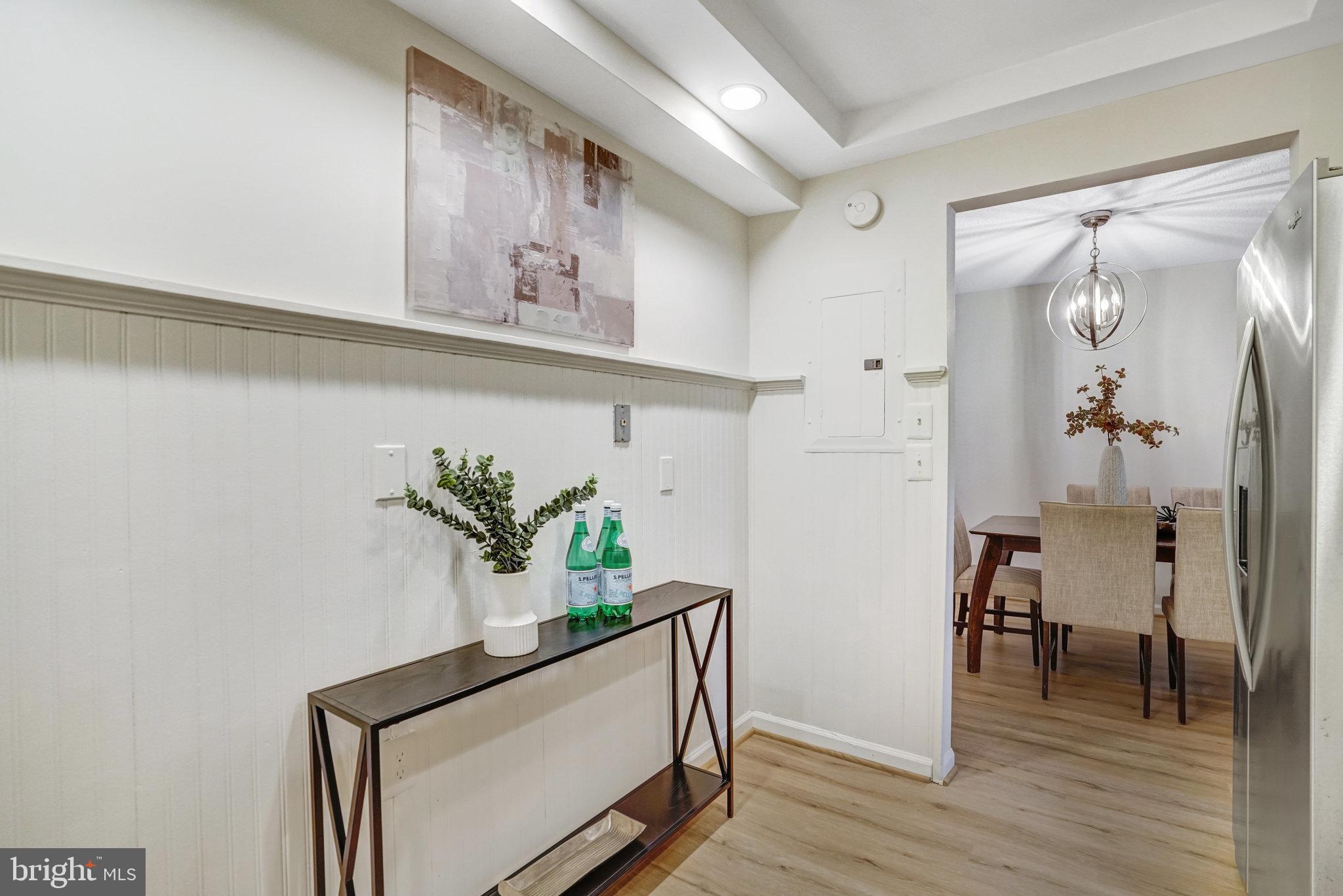 7640 Provincial Drive, Unit 109 McLean, VA 22102 - Photo 21 of 47 a view of hallway with furniture and wooden floor