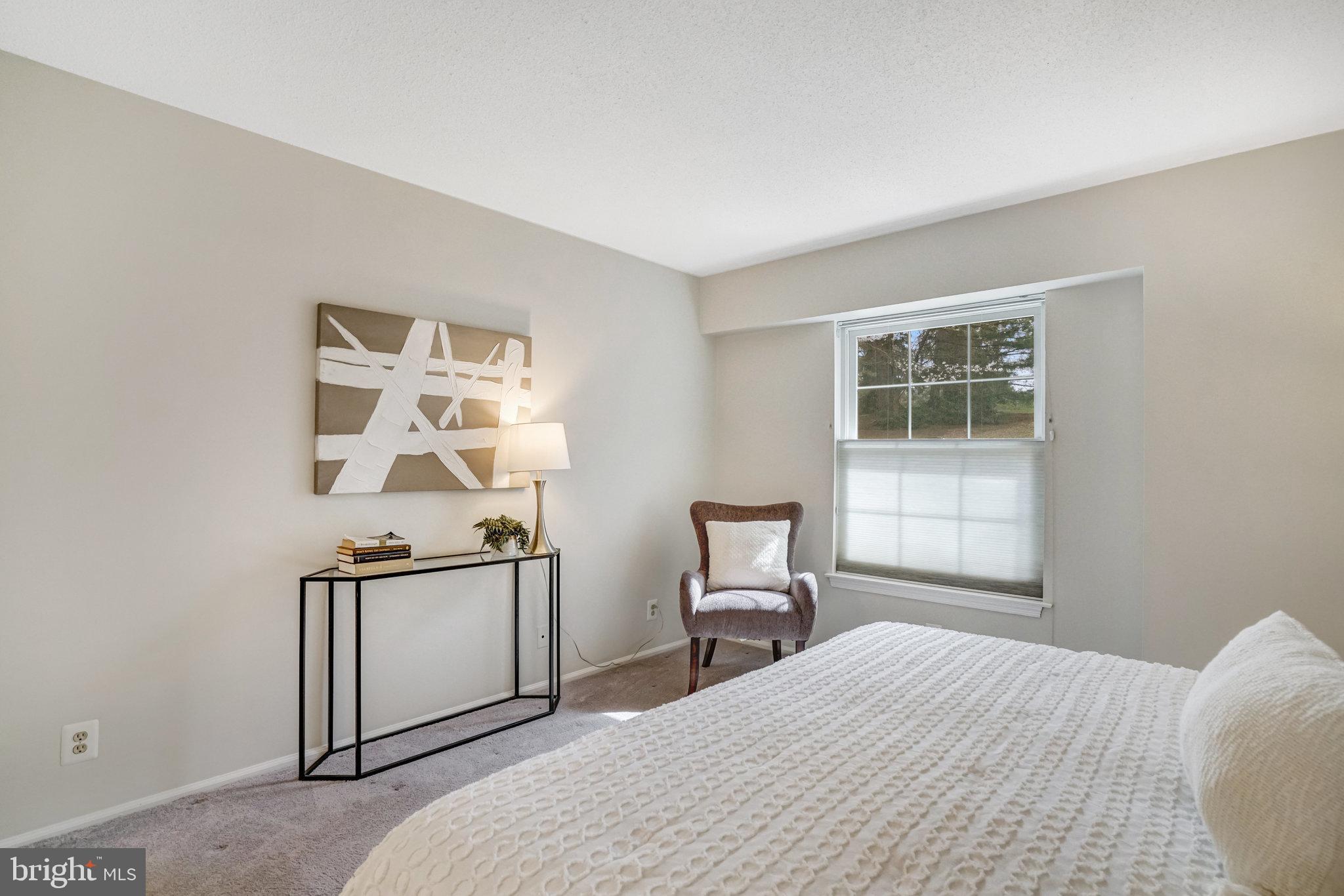 7640 Provincial Drive, Unit 109 McLean, VA 22102 - Photo 24 of 47 a bedroom with a bed and a window