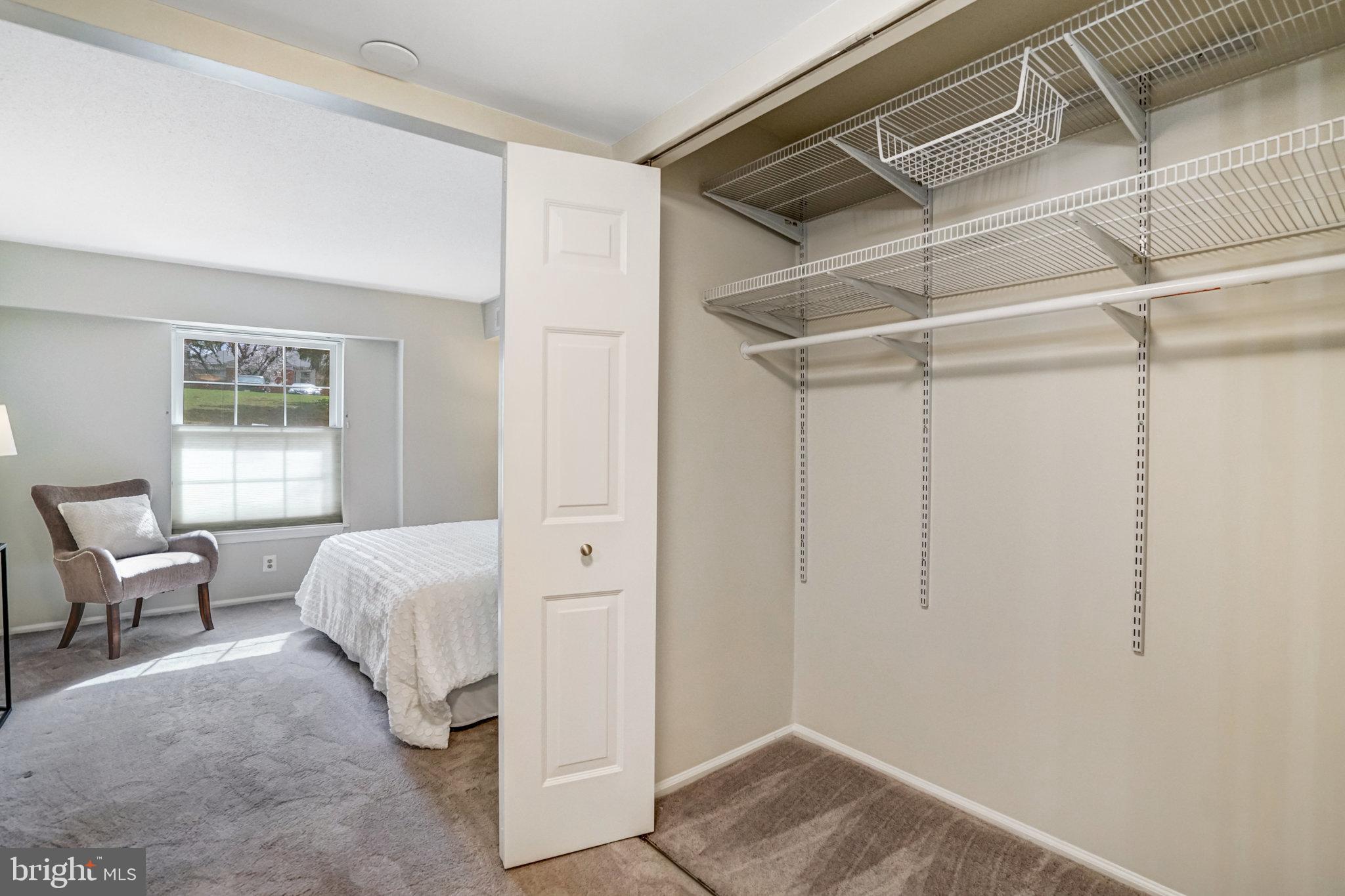 7640 Provincial Drive, Unit 109 McLean, VA 22102 - Photo 27 of 47 a bedroom with a bed and a window