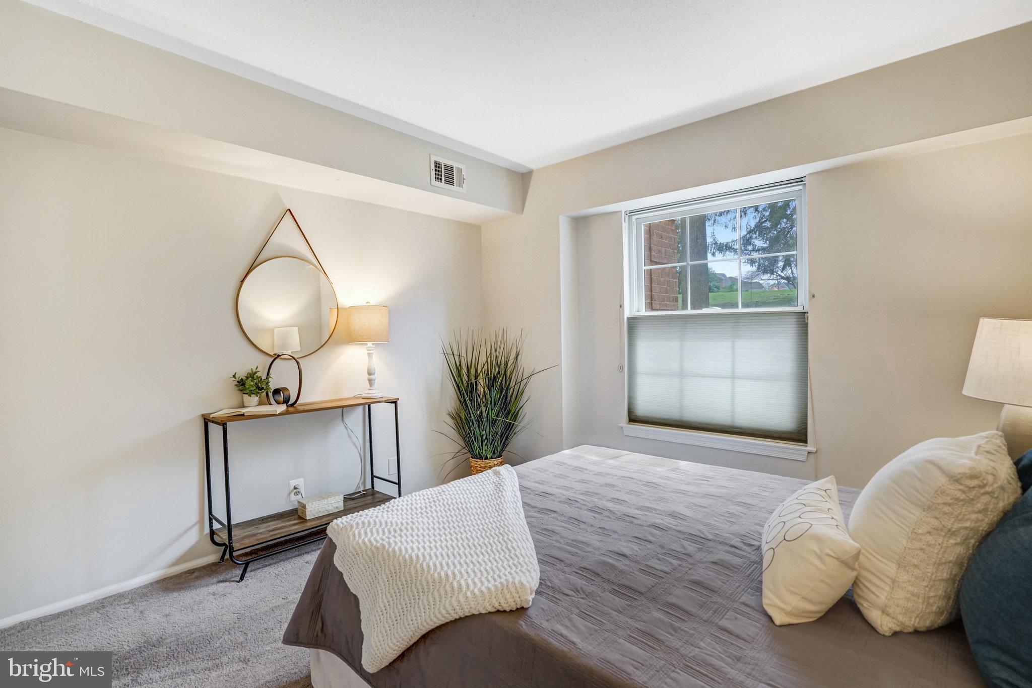 7640 Provincial Drive, Unit 109 McLean, VA 22102 - Photo 33 of 47 a bedroom with bed and window