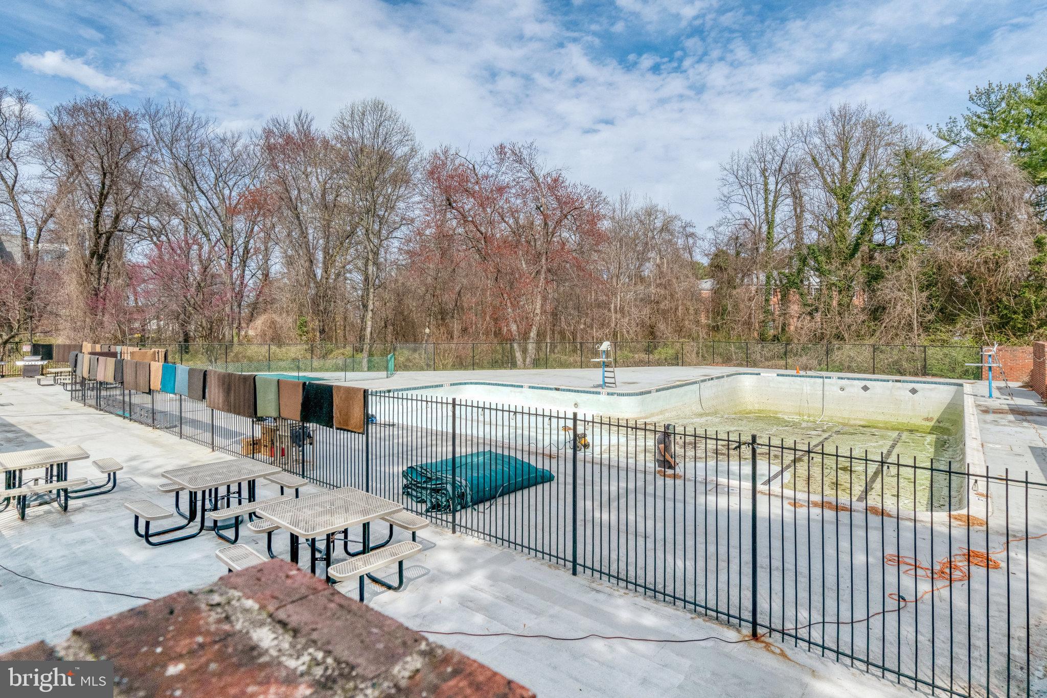 7640 Provincial Drive, Unit 109 McLean, VA 22102 - Photo 37 of 47 a view of a swimming pool with chairs
