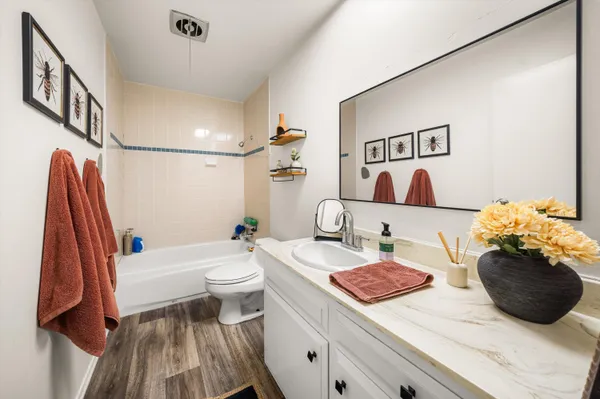 a bedroom with a large bed and a flat screen tv