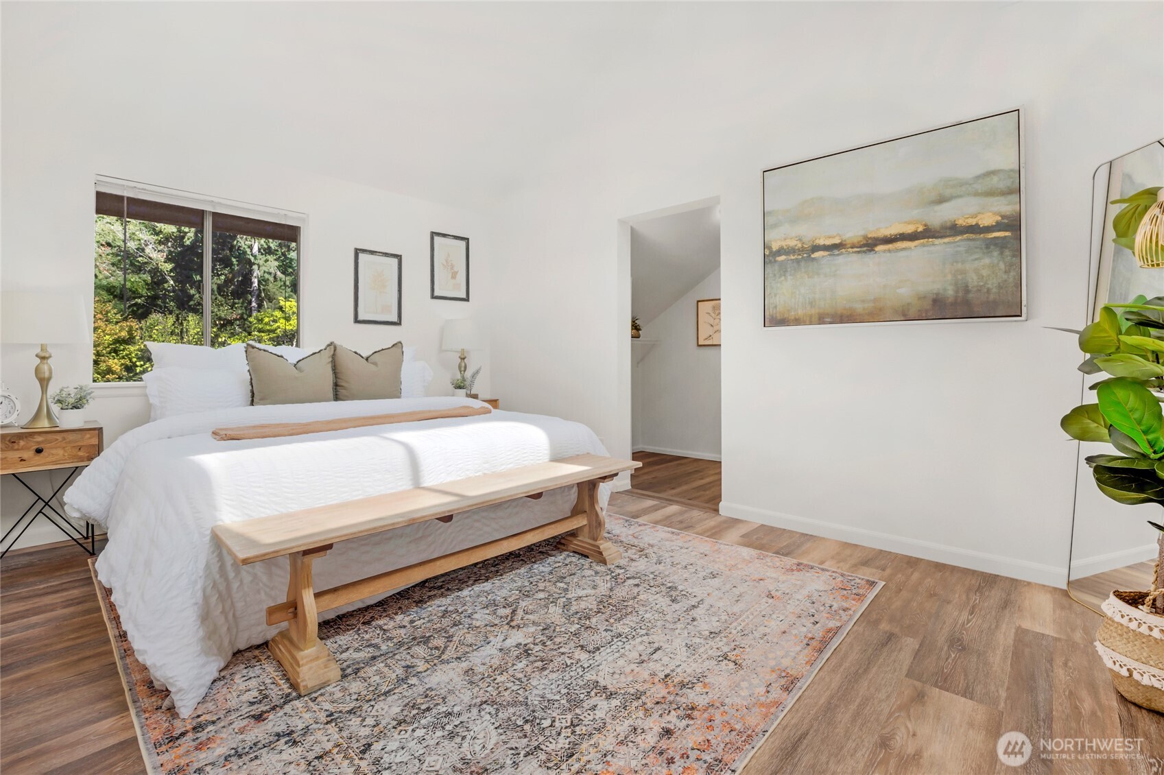 22124 49th Avenue Southeast Bothell, WA 98021 - Photo 25 of 39 a bedroom with a bed and a potted plant