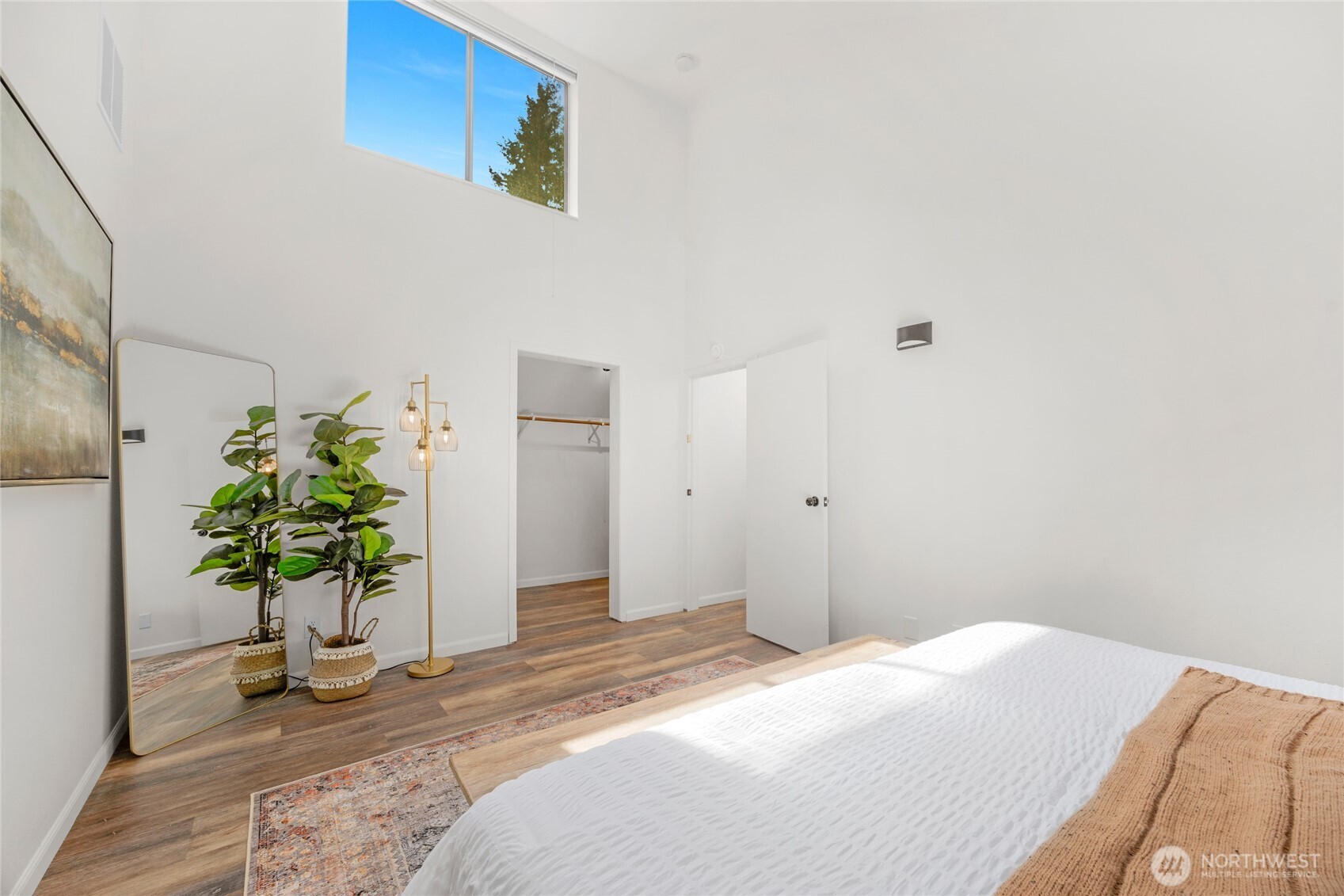 22124 49th Avenue Southeast Bothell, WA 98021 - Photo 28 of 39 a bedroom with a bed and a potted plant