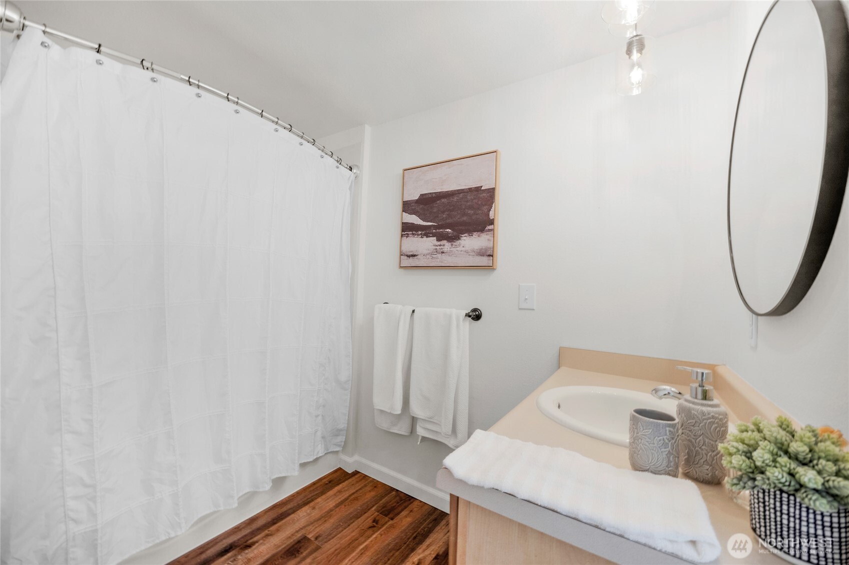 22124 49th Avenue Southeast Bothell, WA 98021 - Photo 30 of 39 a bathroom with a sink and a mirror