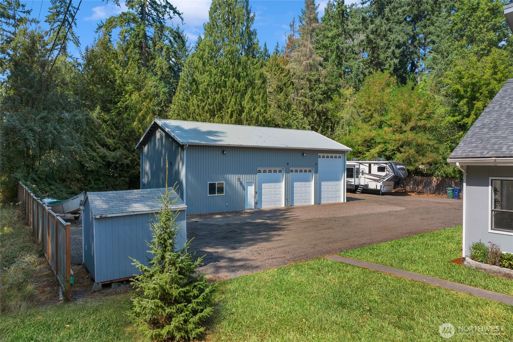 22124 49th Avenue Southeast Bothell, WA 98021 - Photo 35 of 39 a view of a house with a yard plants and large tree