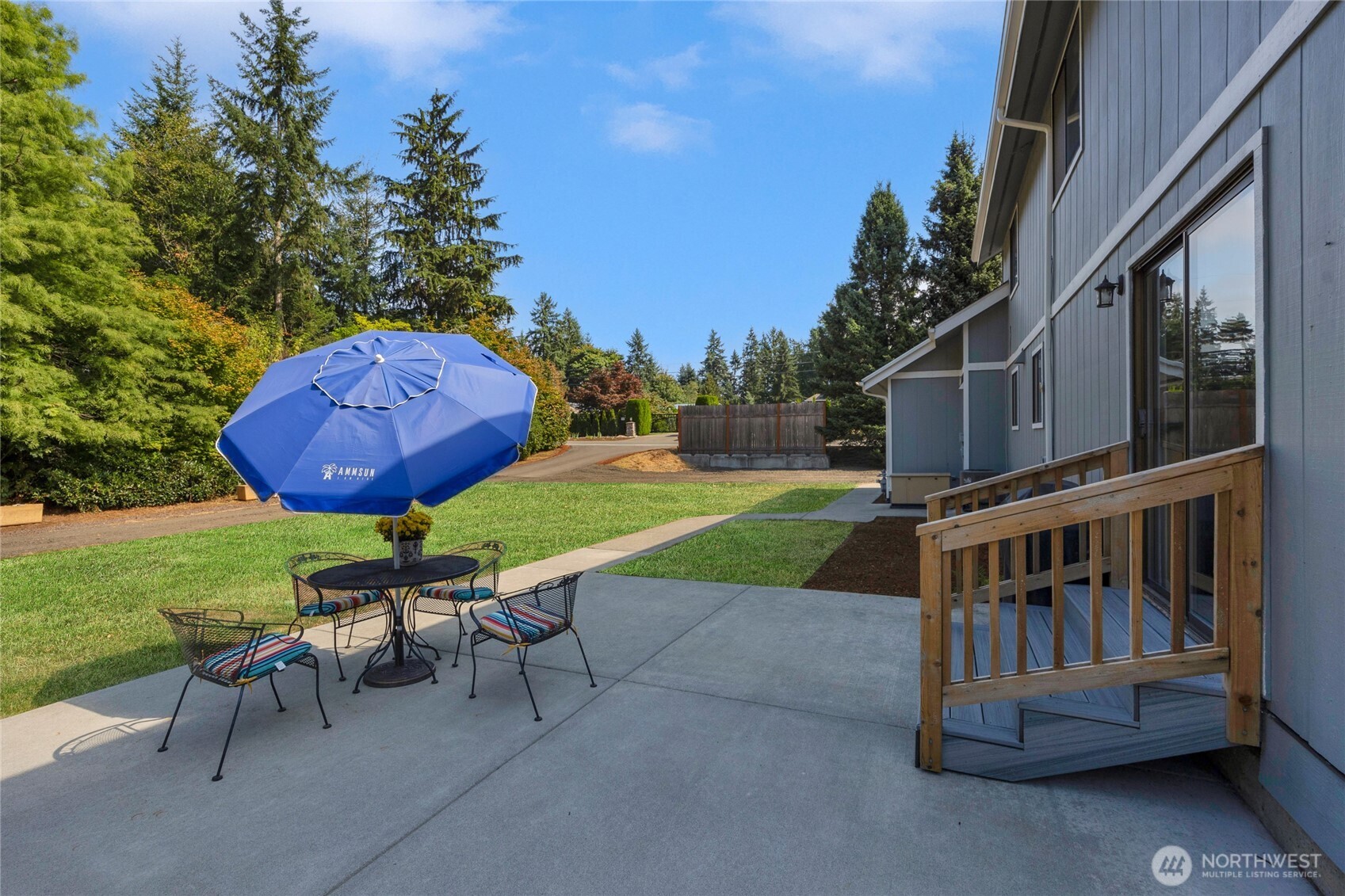 22124 49th Avenue Southeast Bothell, WA 98021 - Photo 8 of 39 a view of a chairs and table in backyard of the house