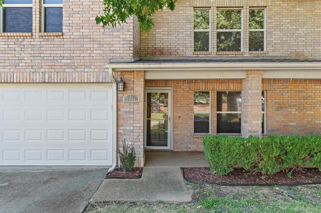 2201 Driskell Lane Corinth, TX 76210 - Photo 3 of 40 a front view of a house with a garden