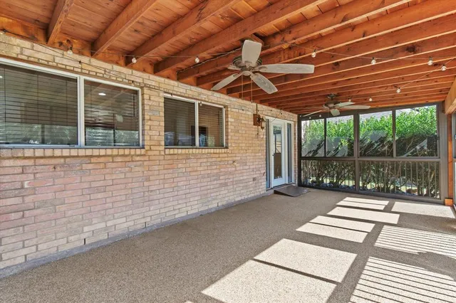a backyard of a house with yard and outdoor seating