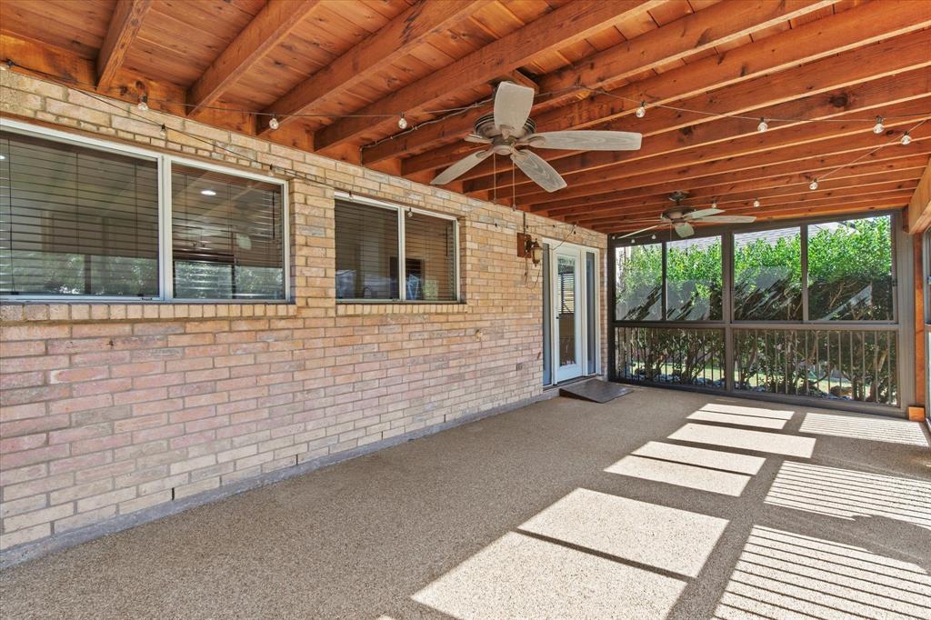 2201 Driskell Lane Corinth, TX 76210 - Photo 35 of 40 a view of a patio with a table and chairs