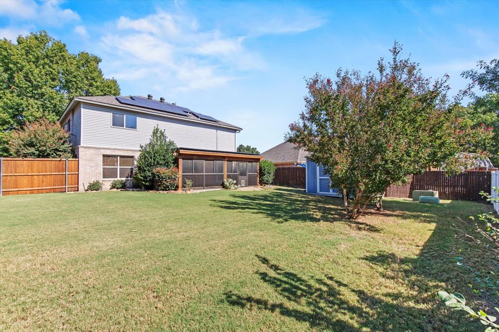2201 Driskell Lane Corinth, TX 76210 - Photo 38 of 40 a view of a yard in front of a house with a large tree