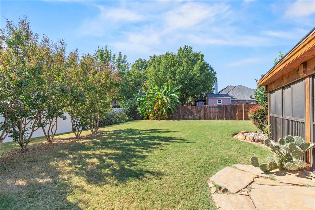 2201 Driskell Lane Corinth, TX 76210 - Photo 39 of 40 a backyard of a house with table and chairs
