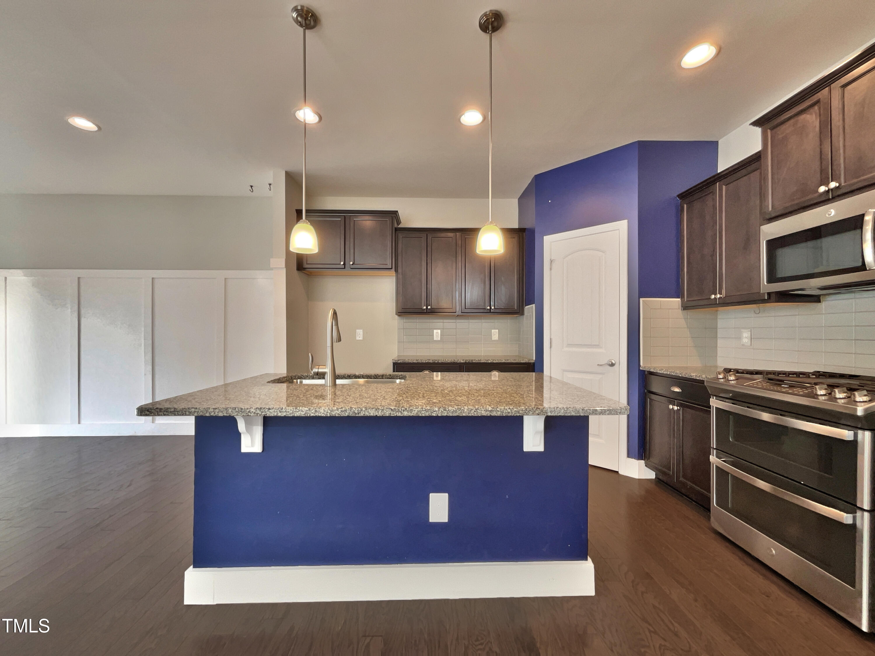 7828 Weathered Oak Way Raleigh, NC 27616 - Photo 11 of 22 a kitchen with stainless steel appliances granite countertop wooden cabinets a sink dishwasher a stove and a refrigerator
