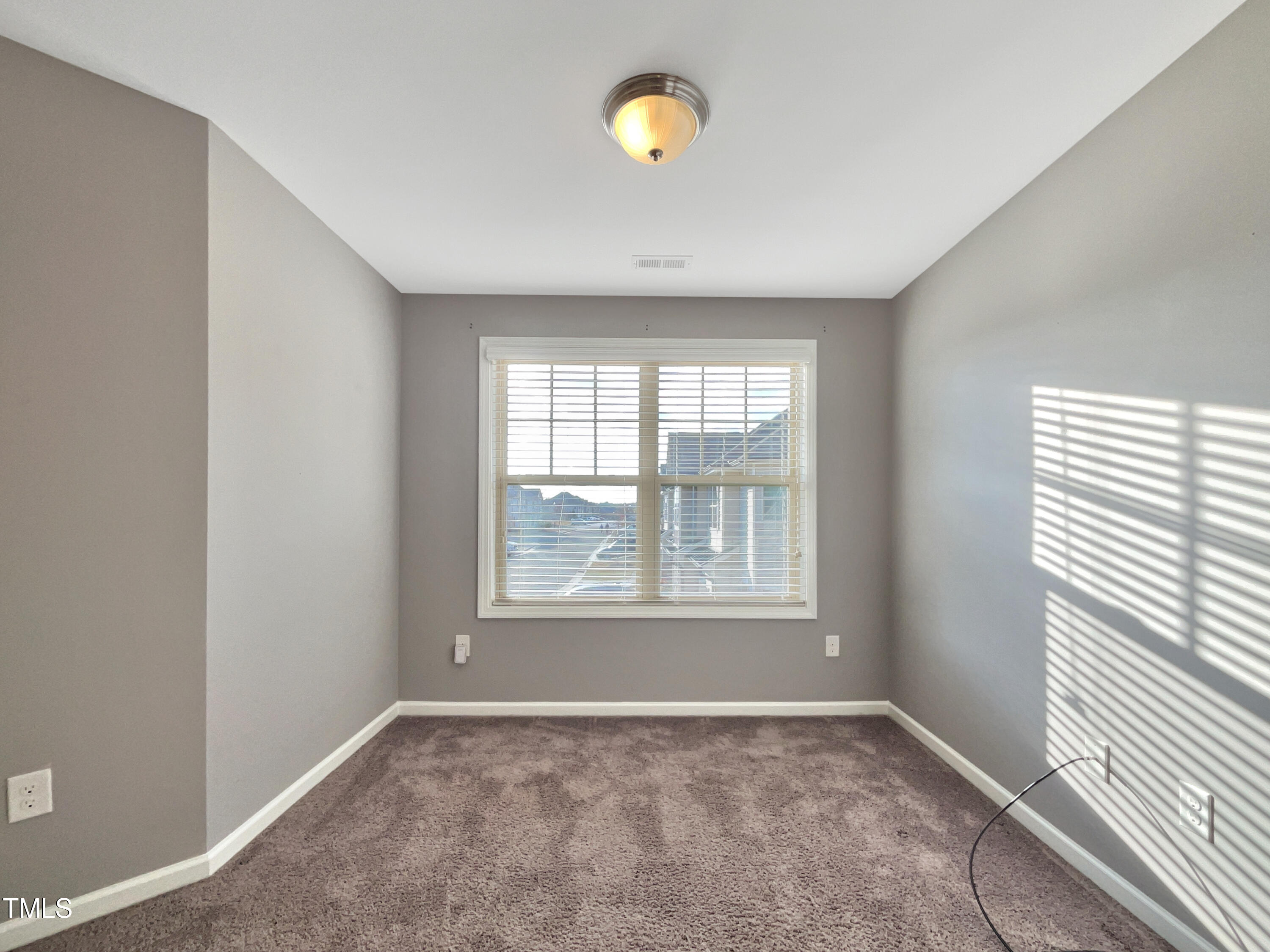 7828 Weathered Oak Way Raleigh, NC 27616 - Photo 15 of 22 an empty room with windows