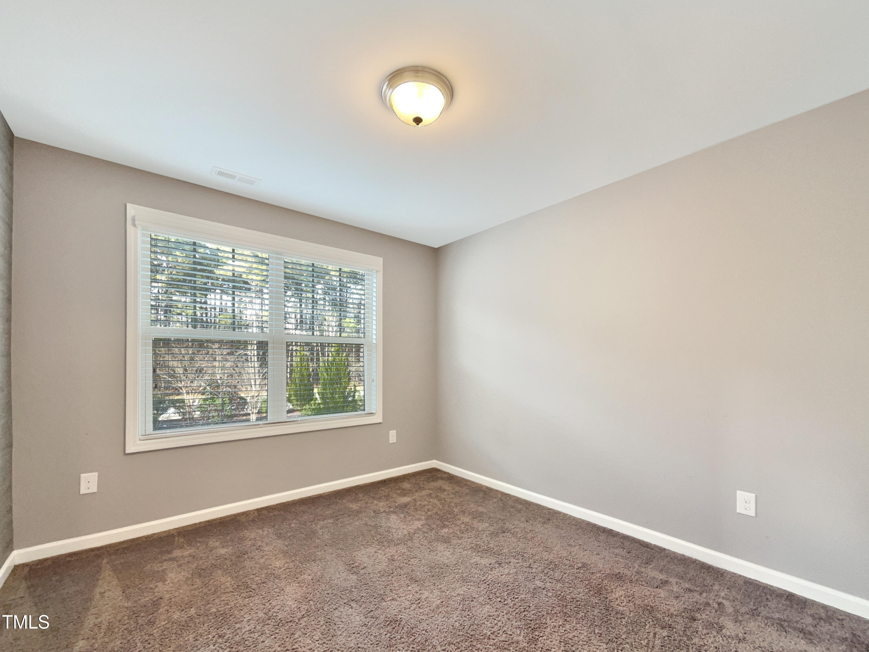 7828 Weathered Oak Way Raleigh, NC 27616 - Photo 16 of 22 an empty room with a window