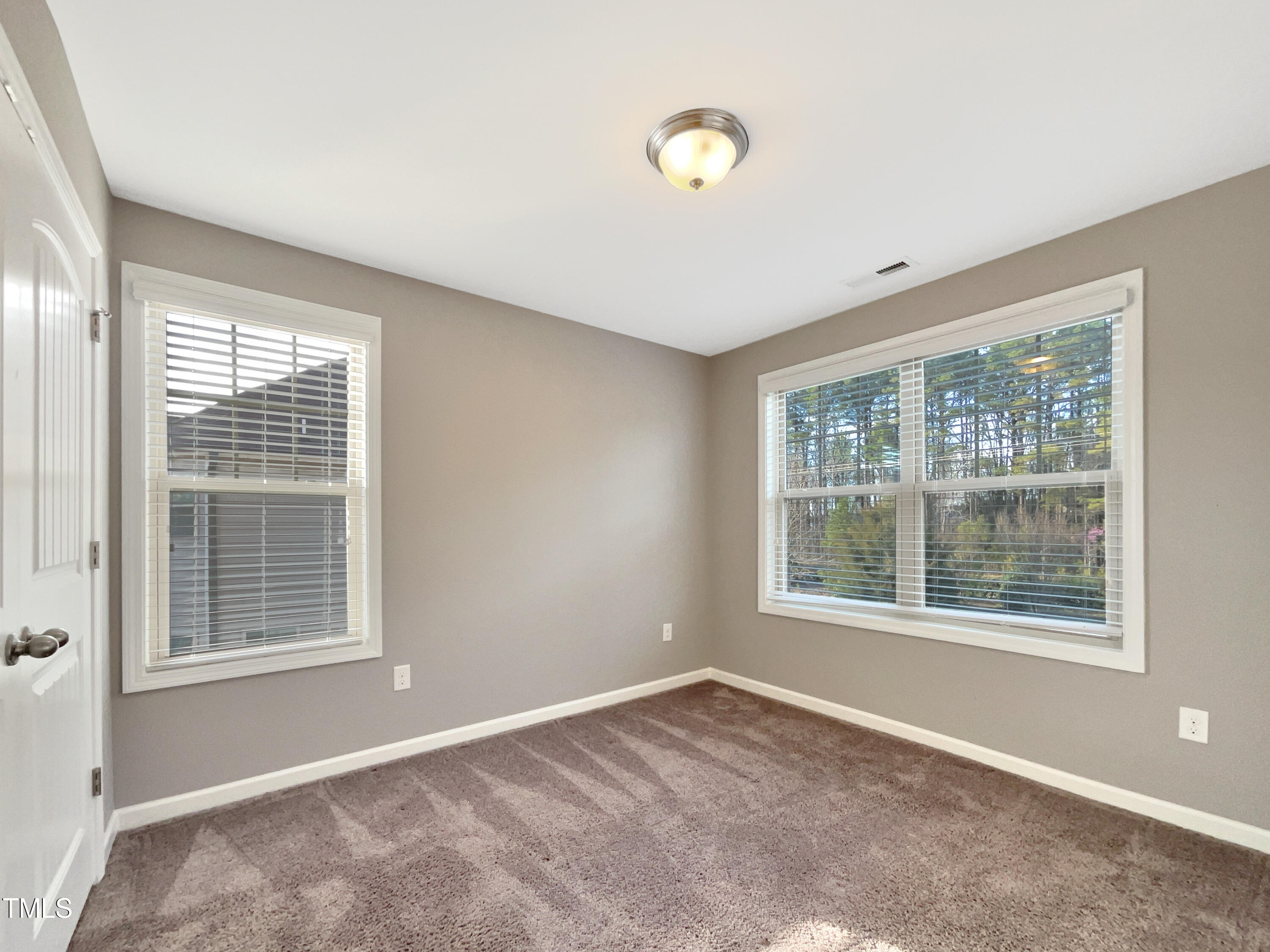 7828 Weathered Oak Way Raleigh, NC 27616 - Photo 17 of 22 a view of an empty room with a window