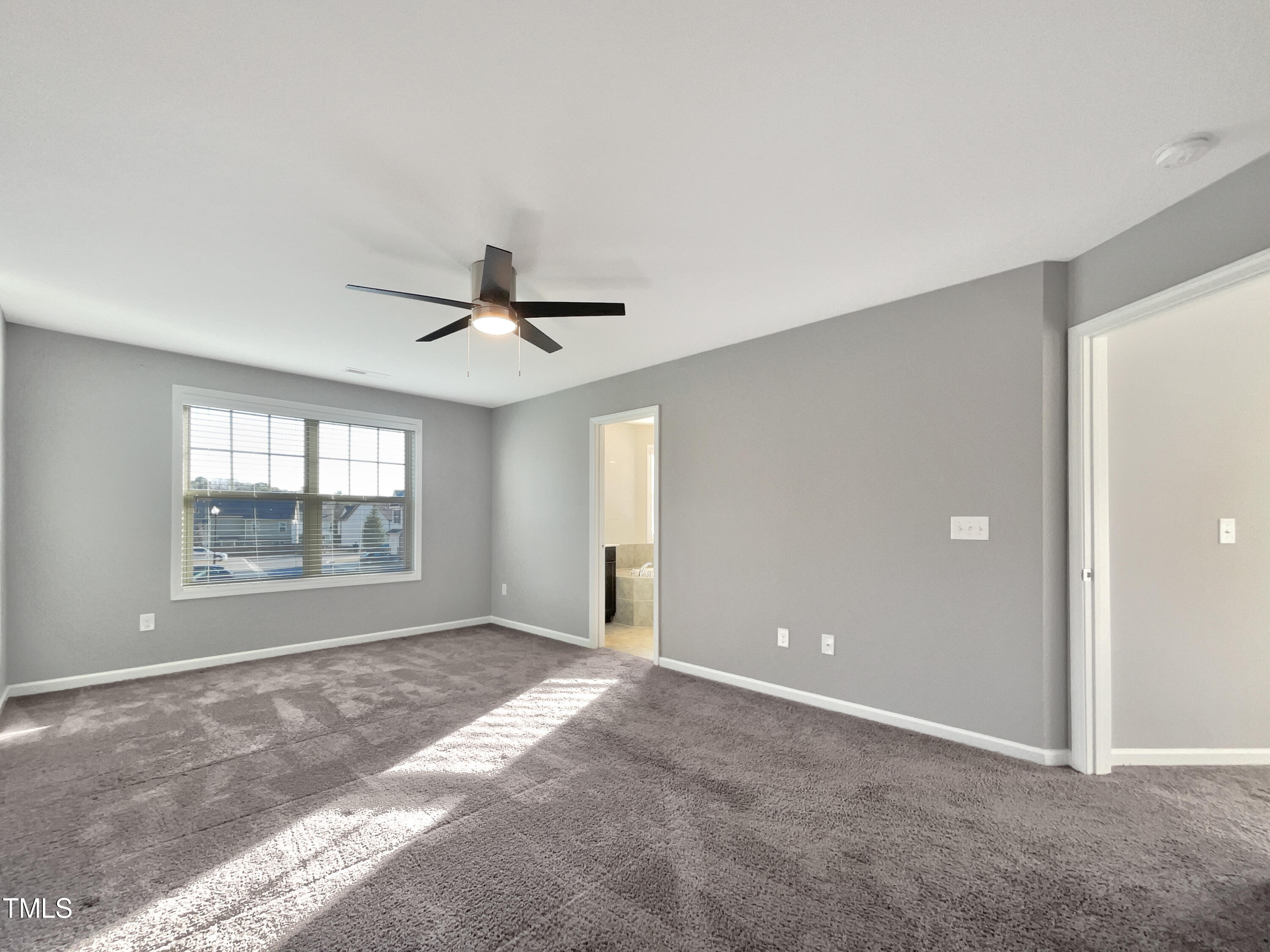 7828 Weathered Oak Way Raleigh, NC 27616 - Photo 5 of 22 a view of an empty room with a window
