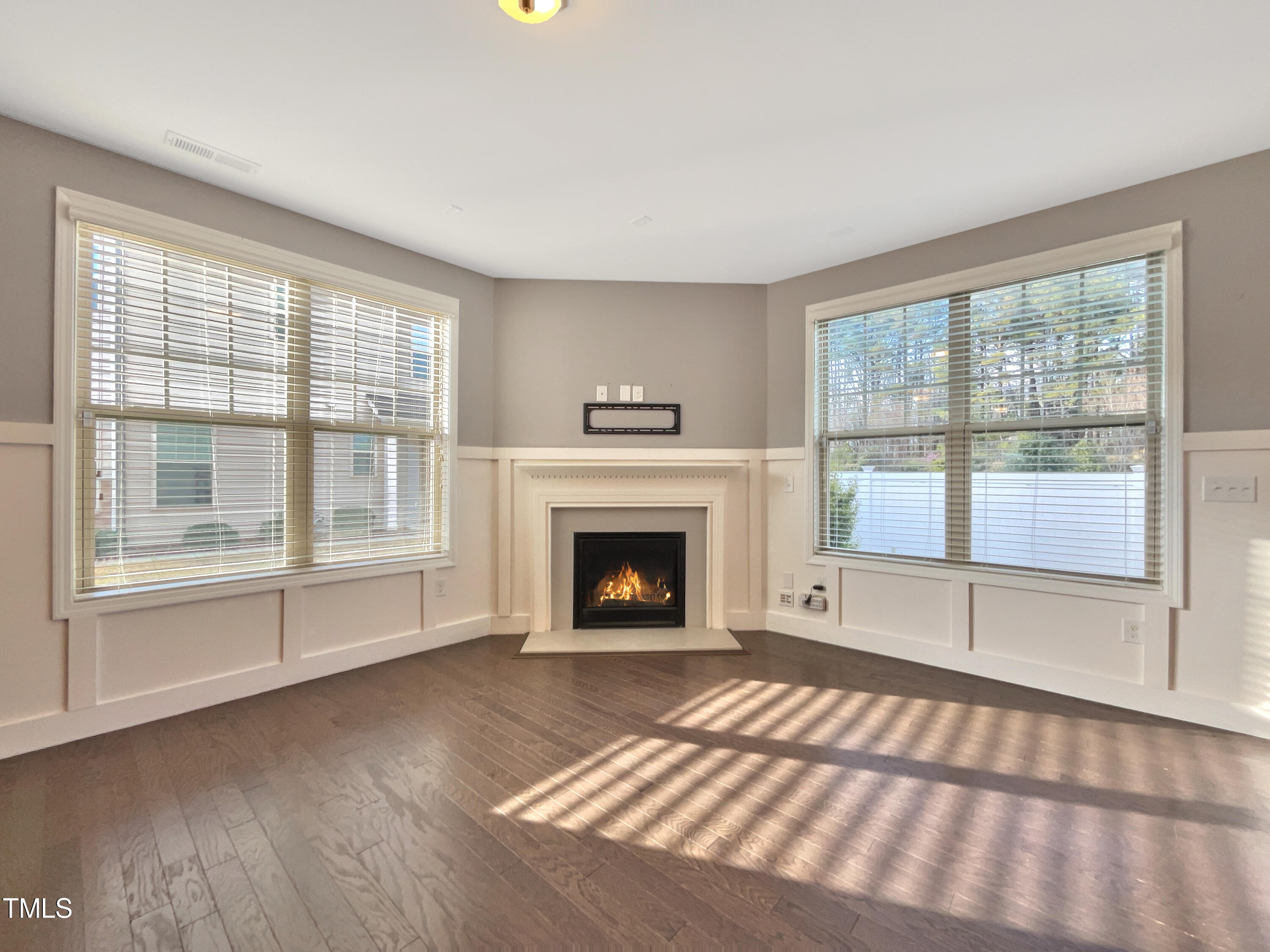 7828 Weathered Oak Way Raleigh, NC 27616 - Photo 9 of 22 a view of an empty room with a fireplace and a window
