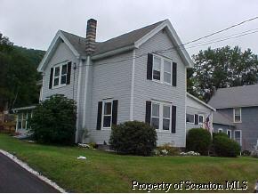 0 Rr2box2077(o Rt11) Hallstead, PA 18822 - Photo 1 of 6 a front view of a house with a yard