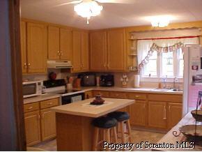 0 Rr2box2077(o Rt11) Hallstead, PA 18822 - Photo 4 of 6 a kitchen with a sink stove and cabinets