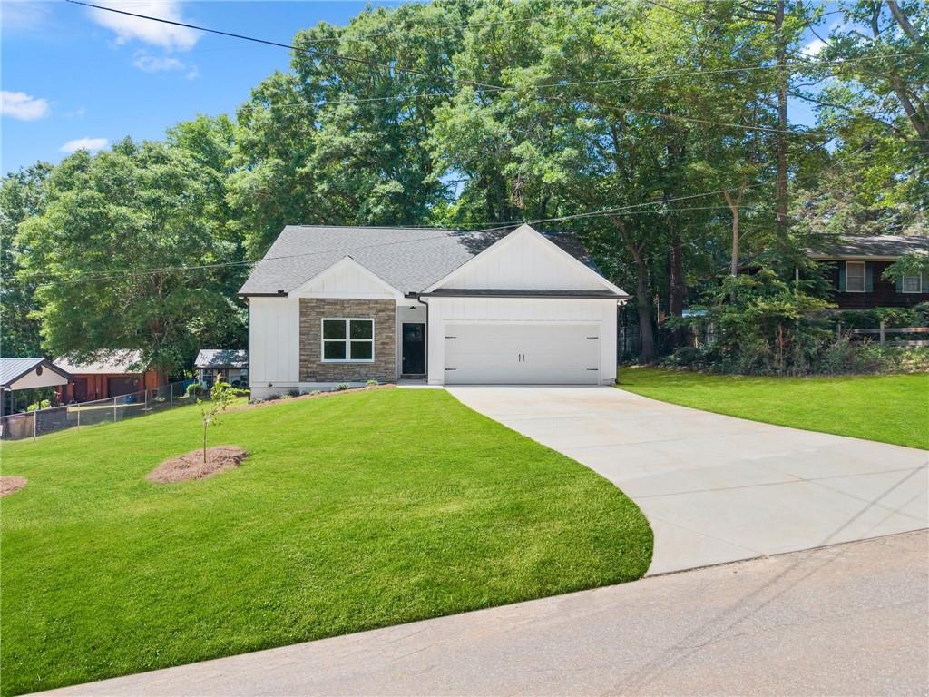 43 Anderson Street Jefferson, GA 30549 - Photo 2 of 45 a front view of a house with a yard