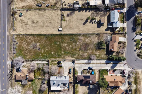 an aerial view of a building with parking