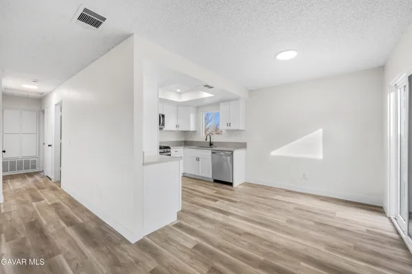 a view of kitchen with wooden floor