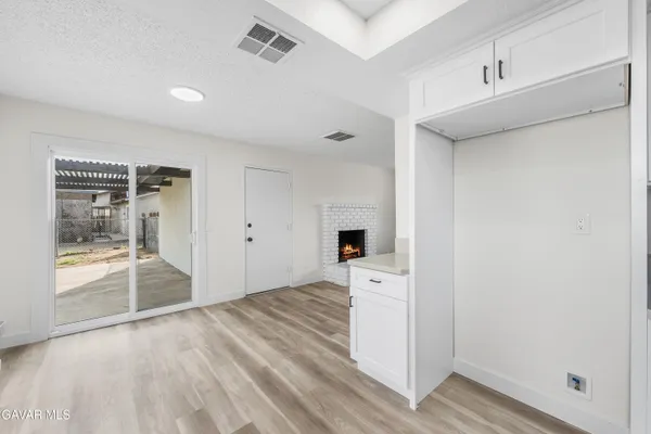 a view of livingroom with hardwood floor and a ceiling fan