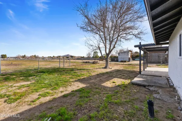 a view of a yard with an ocean view