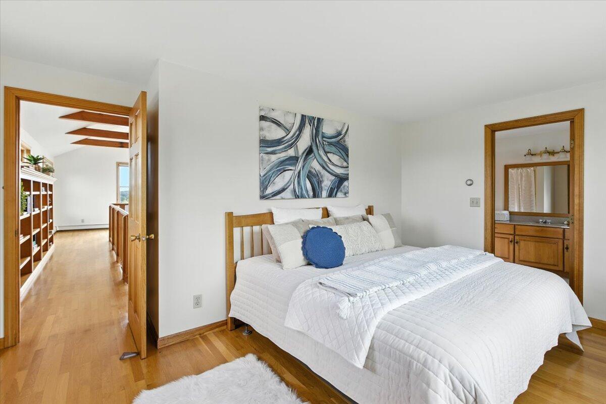 60 Smith Heights Way Eastham, MA 02642 - Photo 23 of 70 a bedroom with a bed and a cabinets