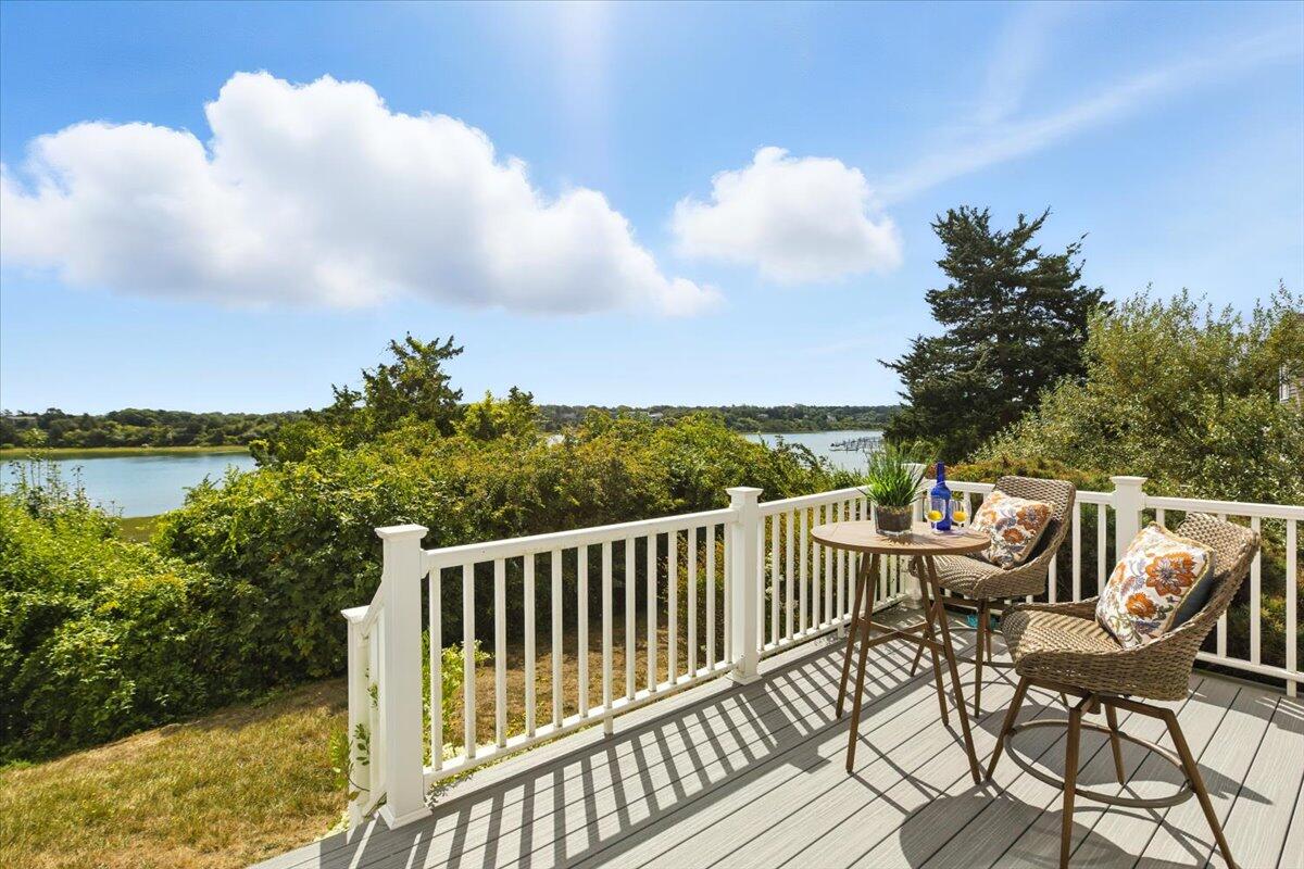 60 Smith Heights Way Eastham, MA 02642 - Photo 30 of 70 a view of a chairs and table on the terrace