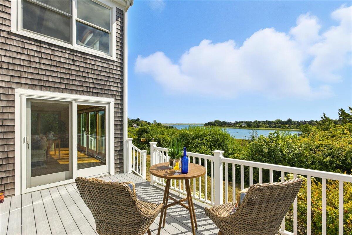 60 Smith Heights Way Eastham, MA 02642 - Photo 31 of 70 a balcony with wooden floor and city view