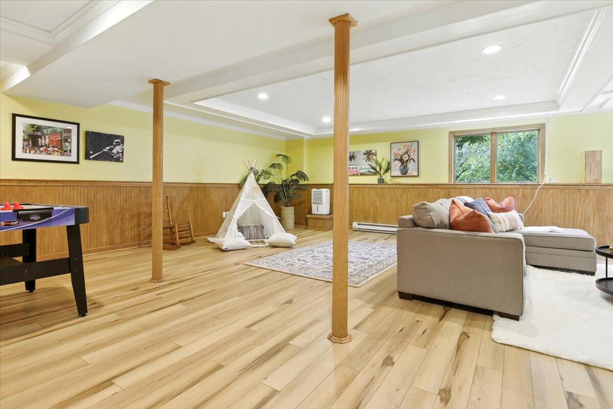 60 Smith Heights Way Eastham, MA 02642 - Photo 38 of 70 a living room with furniture and a flat screen tv