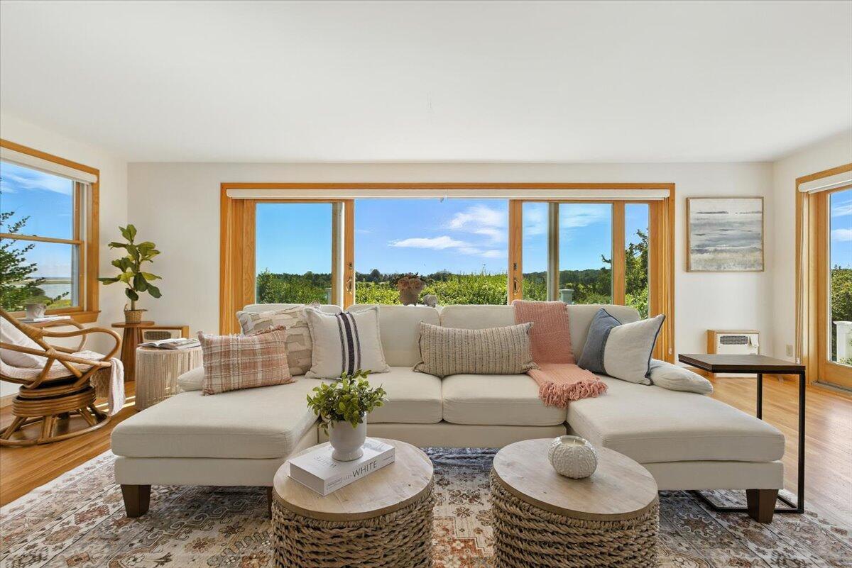 60 Smith Heights Way Eastham, MA 02642 - Photo 40 of 70 a living room with furniture and a large window