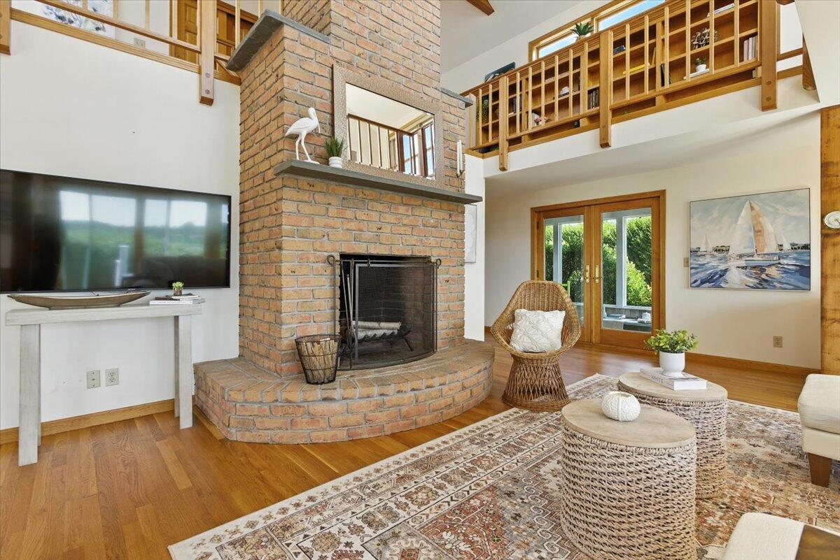 60 Smith Heights Way Eastham, MA 02642 - Photo 41 of 70 a living room with furniture a flat screen tv and kitchen view