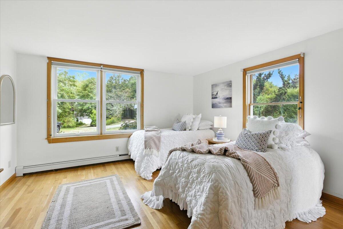 60 Smith Heights Way Eastham, MA 02642 - Photo 55 of 70 a bedroom with two beds and a large window