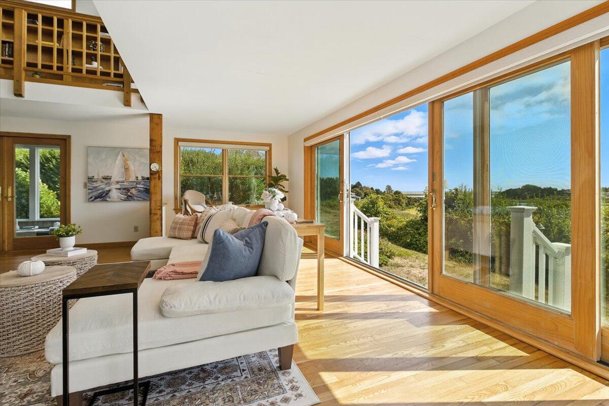 60 Smith Heights Way Eastham, MA 02642 - Photo 63 of 70 a living room with furniture and a large window