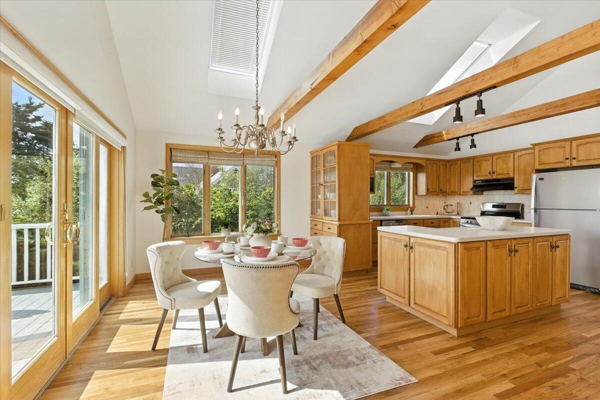 60 Smith Heights Way Eastham, MA 02642 - Photo 67 of 70 a dining room with furniture a chandelier and wooden floor